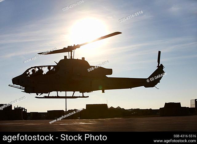 United States Marine Corps AH-1W SuperCobra attack helicopter launches on a combat operation in the Helmand Province, Afghanistan