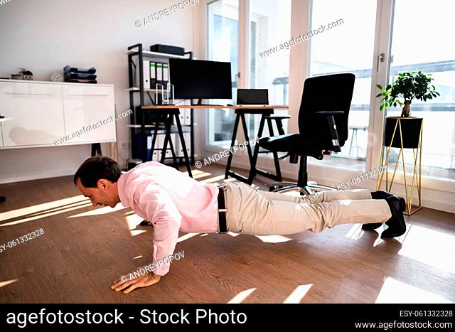 Workout Office Exercise. Healthy Doing Pushups In Office