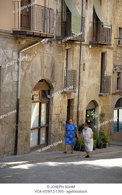 Two older women walking in village of Solsona, Cataluna, Spain
