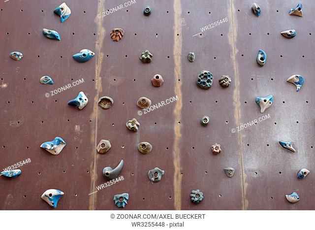 artificial climbing wall with a variety of holds