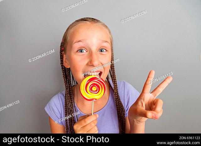happy girl woman with lollipop