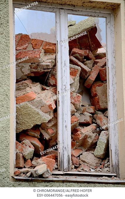 Window provides insight to the house demolition