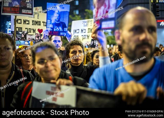 16 December 2023, Israel, Tel Aviv: Israelis and family member of the hostage families protest outside Kiriya military base calling on Prime Minister Benjamin...