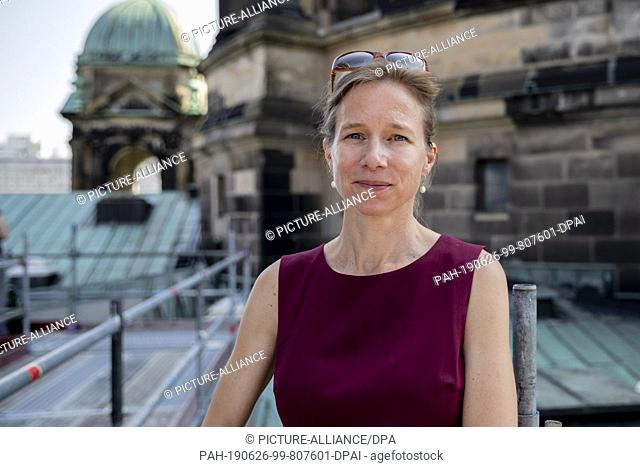 26 June 2019, Berlin: Sonja Tubbesing, cathedral architect for the Berlin Cathedral, stands on the roof of the Berlin Cathedral during an exercise with fire...