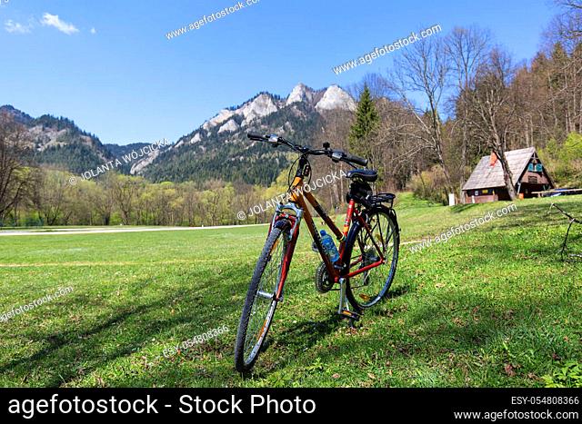 Szczawnica, Dunajec River George, Poland - April 20, 2019: View on Three Crowns Massif from the side of the Red Monastery, Pieniny Mountains, tourist bike
