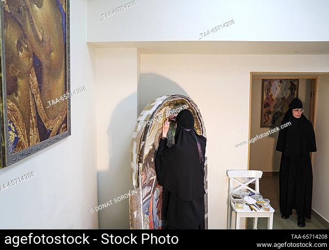 RUSSIA, YEKATERINBURG - DECEMBER 13, 2023: Nuns assemble a large Nativity at a mosaic workshop of Alexander Nevsky Novo-Tikhvinsky Convent