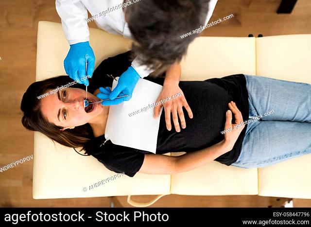 Pregnant Woman Tooth Decay. Dentistry Check By Dentist
