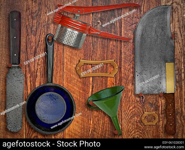 vintage kitchen utensils over wooden wall, space for text and name