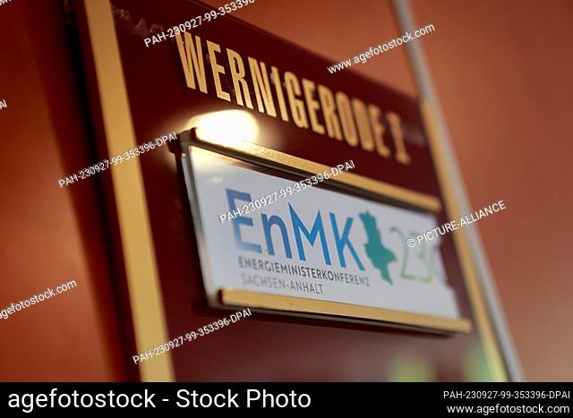 27 September 2023, Saxony-Anhalt, Wernigerode: A sign with the imprint of ENMK 2023 hangs on a door of the conference hotel