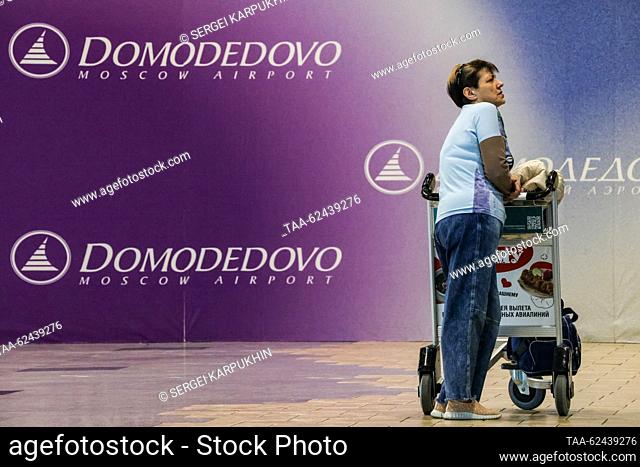 RUSSIA, MOSCOW REGION - SEPTEMBER 21, 2023: A traveller with a luggage trolley is seen at the Domodedovo International Airport. Sergei Karpukhin/TASS
