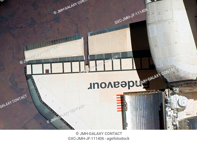 An overhead view of part of Space Shuttle Endeavour's starboard wing and part of its orbital maneuvering system (OMS) pods was provided by Expedition 16...