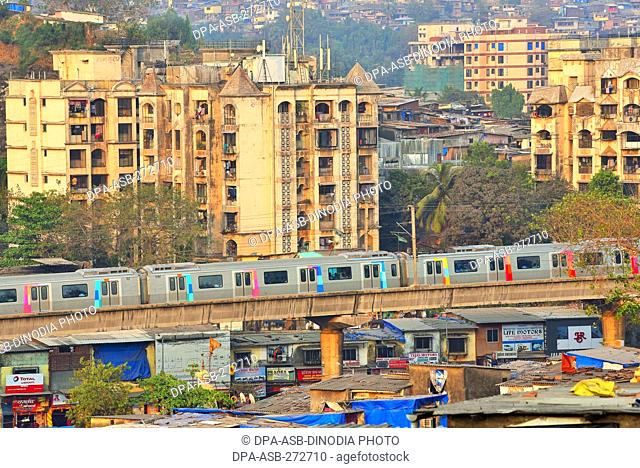 Metro train near Asalpha railway station, Mumbai, Maharashtra, India, Asia
