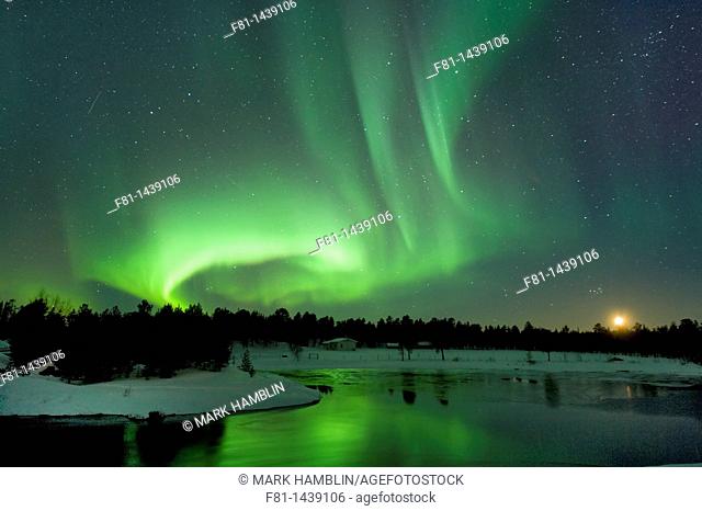 Aurora borealis Northern lights at moonset near Inari, Lapland, Finland, March