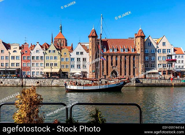 Gdansk, Poland - Sept 9, 2020: Old town of Gdansk with the Mariacka Gate and a promenade along the riverbank of Motlawa River