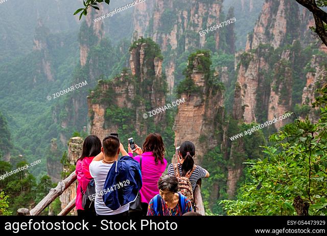 Wulingyuan, China - May 27, 2018: Tourists on pathway in Tianzi Avatar mountains nature park
