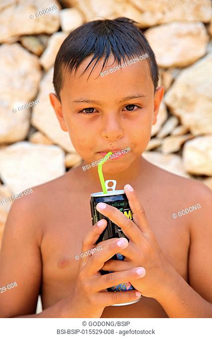 9-year-old boy drinking