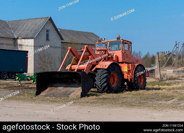 Old big tractor left at the farms