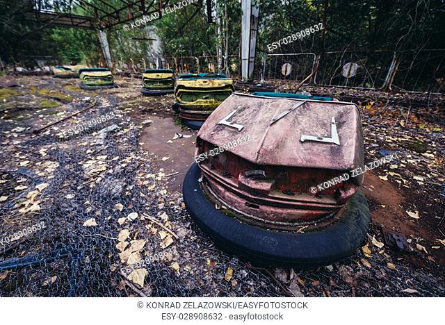 Bumper cars in amusement park of Pripyat ghost city, Chernobyl Nuclear Power Plant Zone of Alienation around nuclear reactor disaster in Ukraine