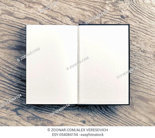 Open blank book on wooden background. Flat lay