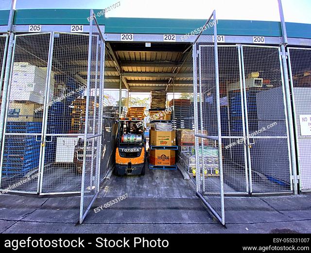 Sydney, NSW / Australia - August 2 2020: Sydney Markets supplies a third of Australia's population with fresh produce. Pictured an open market traders storage...