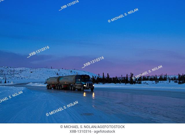Heavy trucks on the ice road from Tibbitt to Contwoyto beginning just outside of Yellowknife, Northwest Territories, Canada  MORE INFO This seasonal ice road is...