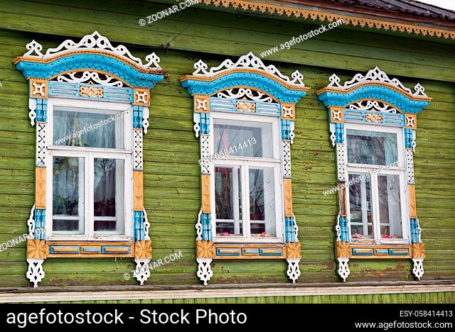 Carved window in an old russian wooden country house