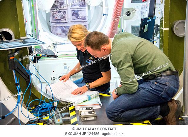 NASA astronaut Karen Nyberg, Expedition 3637 flight engineer; and Russian cosmonaut Sergey Ryzansky, Expedition 3738 flight engineer