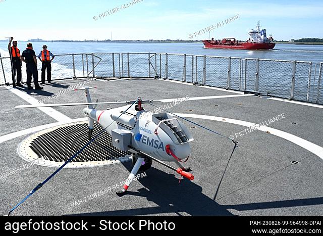 PRODUCTION - 25 August 2023, Lower Saxony, Cuxhaven: The CAMCOPTER S-100 from the Austrian company Schiebel is secured on board the BP82 ""BAMBERG""
