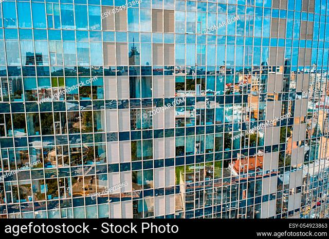 Street reflection on glass steel building facade, close view