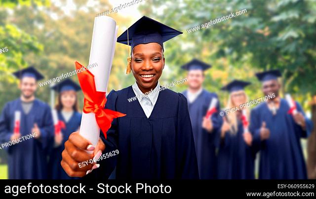 happy female graduate student with diploma