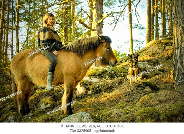 Girl on a horse in Swedish nature
