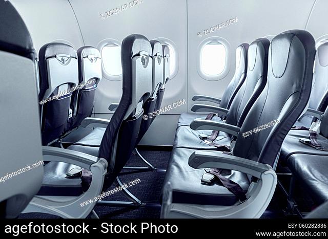 Empty landed passenger airplane cabin during coronavirus outbreak. Global pandemic stopped all travel destinations between countries