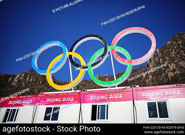 30 January 2022, China, Yanqing: The Olympic rings are placed in the finish area at the National Alpine Ski Center. The Beijing Winter Olympics will take place...