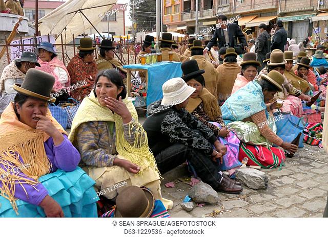 Aymara women during festival, street scene in Achacachi, Bolivia