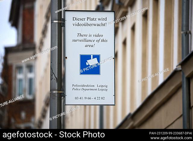 07 December 2023, Saxony, Leipzig: A sign at the Eisenbahnstraße/Hermann-Liebmann-Straße junction indicates that the police are monitoring public spaces by...