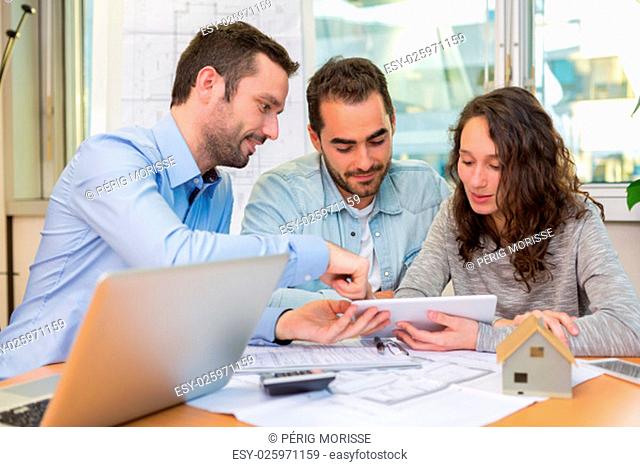 View of a Young attractive people meeting real estate agent at the office
