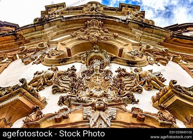 Baroque style sculptures and ornaments on the front facade of a old and historic church in the city of Ouro Preto in Minas Geraisil