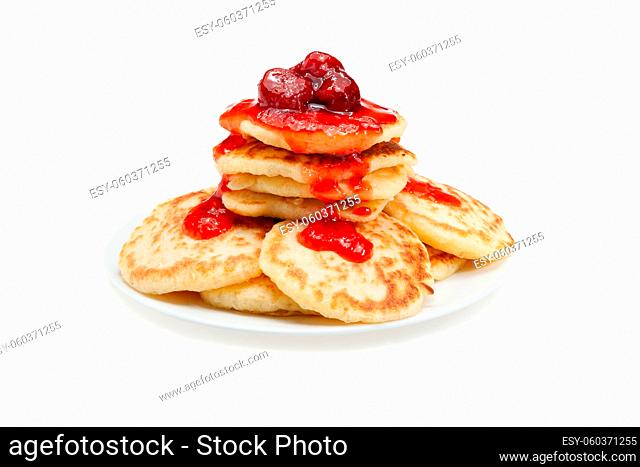 Stack of pancakes with strawberry jam. Isolated at white background