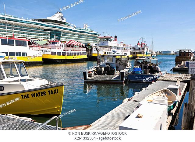 Water Taxis docked next to Royal Caribbean cruise ship in Casco Bat at Portland, Maine