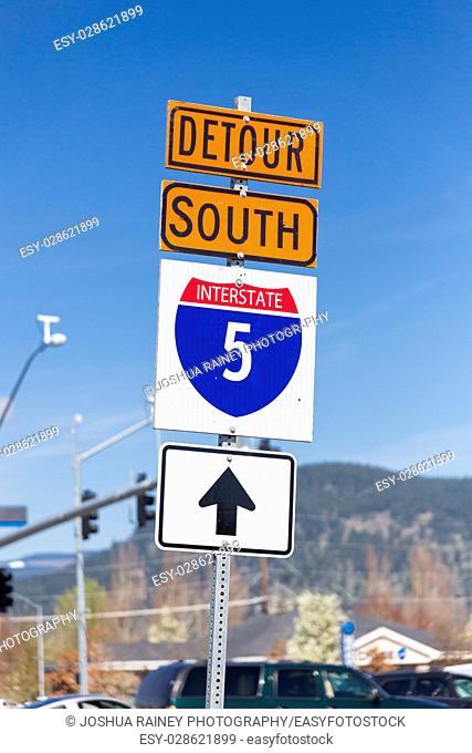 Orange detour sign for Interstate 5 or I5 South detoured through the city to avoid the road construction on the freeway