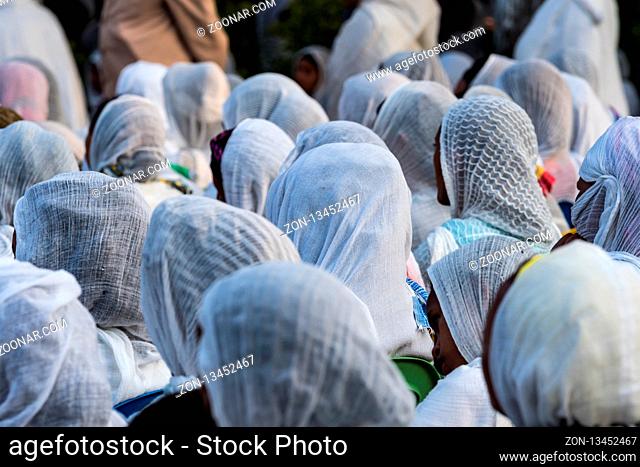 Ethiopian Orthodox women wearing white capes praying in Miskaye Hizunan Medhanealem church in Addis Ababa Ethiopia