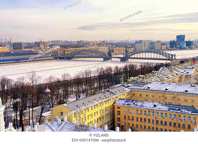 View of St. Petersburg from the observation deck of the Smolny Cathedral, you can see the Bolshoyhten bridge over the ice-covered river Neva