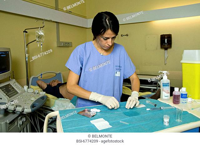 Photo essay at Saint-Louis hospital, Paris, France. Department of nephrology. The nurse is preparing the material for the renal biopsy on a patient with kidney...