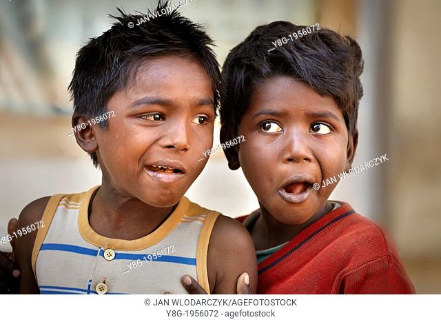 Portrait of a young indian boys eating sweets, Udaipur, Rajasthan, India