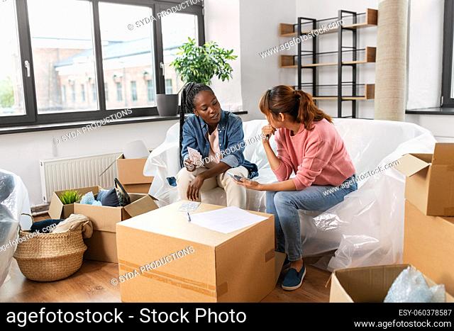 women moving to new home and counting money