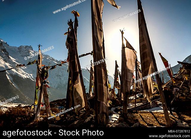 Prayer flags on the earthquake-destroyed temple at Kyamjin Gumba, Langtang Valley, Rasuwa, Nepal