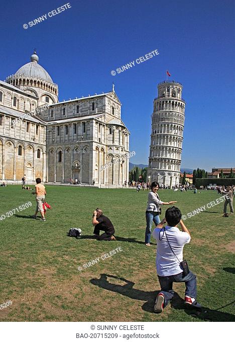 tourist taking pictures at the leaning tower at Pisa, Tuscany, Italy