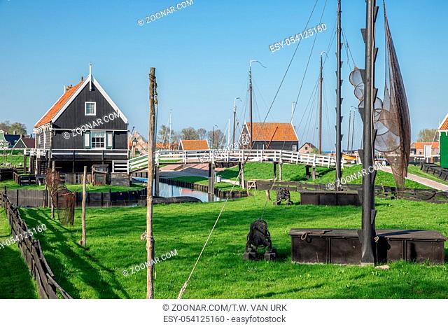 Traditional houses of a fishing village with nets drying in the wind - Enkhuizen, The Netherlands