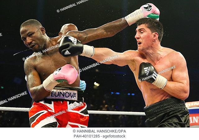 German WBO cruiserweight world champion Marco Huck (R) and his British challenger Ola Afolabi fight for the world championship title at Max-Schmeling-Hall in...