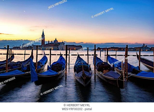 Italy, Veneto, Venice, Gondolas in front of San Giorgio Maggiore, early morning